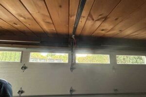 Technician performing garage door repair in San Rafael California