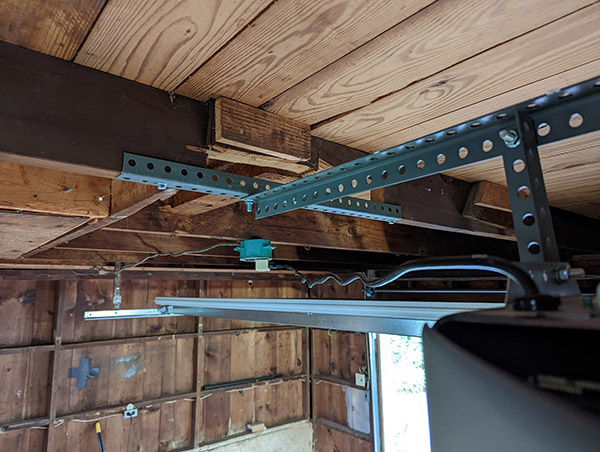 Technician replacing garage door rollers in San Rafael California