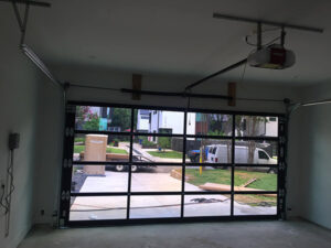 Technician repairing garage door hinges in San Rafael California